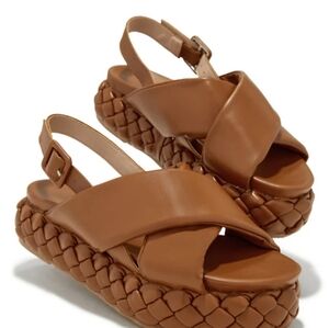 .5 in crisscross platform sandles. (NEVER WORN)